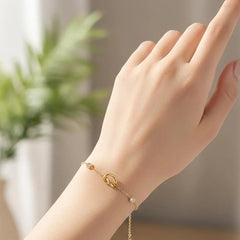 Gold Plated Chain Bracelet Featuring A Knot Motif
