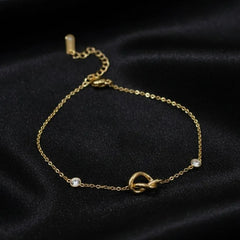 Gold Plated Chain Bracelet Featuring A Knot Motif