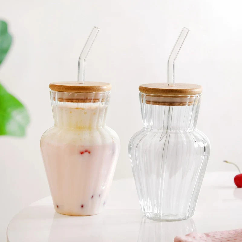 Curved ribbed glass tumbler