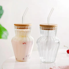 Curved ribbed glass tumbler