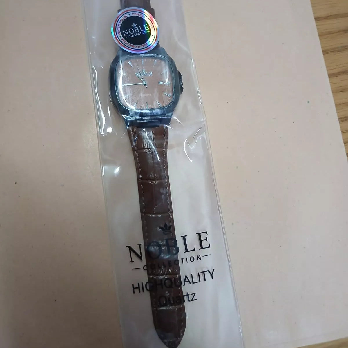 Noble Collection dark-colored bezel & brown leather strap Watch