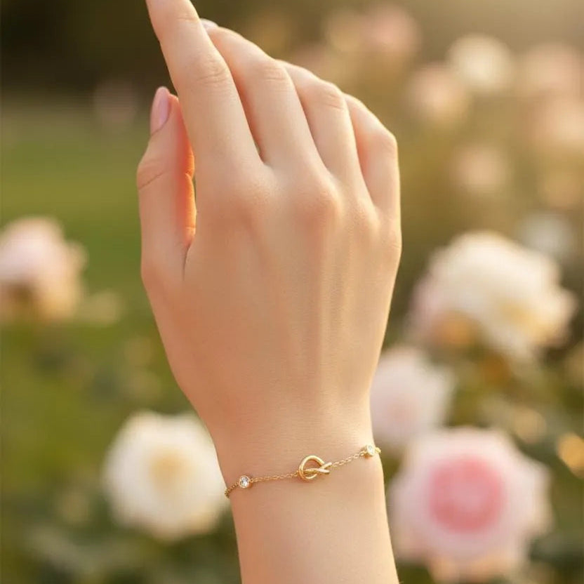 Gold Plated Chain Bracelet Featuring A Knot Motif