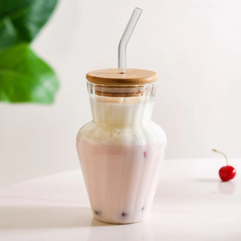 Curved ribbed glass tumbler
